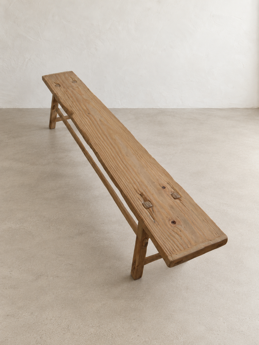 Handcrafted pine Longhouse Bench showing its natural wood grain and lightly aged character.