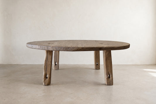 The Croft Coffee Table — 45-inch round solid wood coffee table in a natural aged finish, front view
