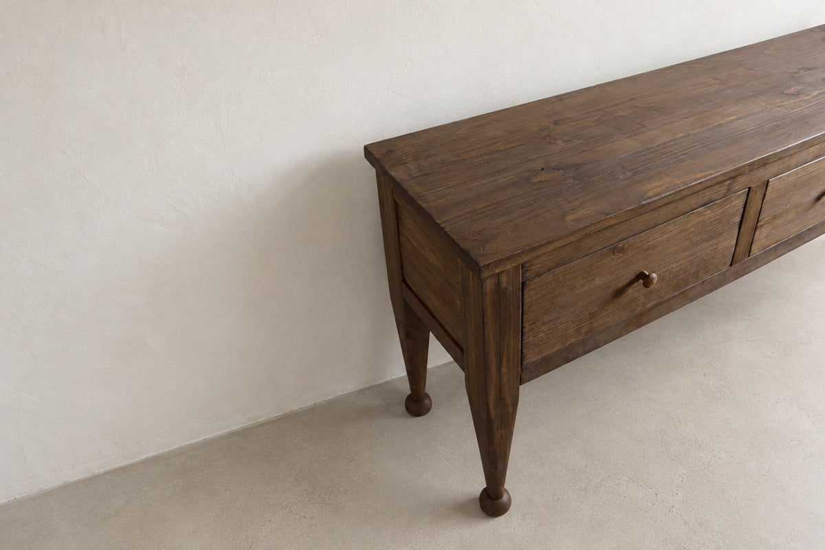 The Estate Console in Aged Umber finish, elevated three-quarter detail view