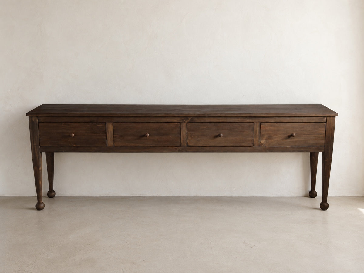The Estate Console in Aged Umber finish, front view of 96-inch four-drawer solid wood console
