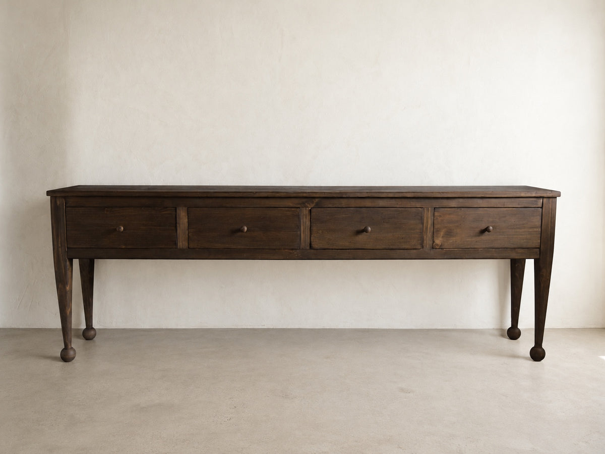 The Estate Console in Aged Umber finish, wide front view of 96-inch four-drawer solid wood console