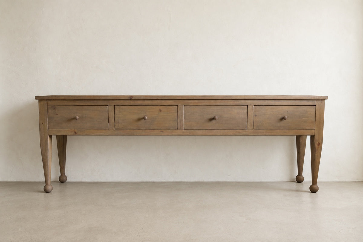 The Estate Console in Weathered Natural finish, front view of 96-inch four-drawer solid wood console
