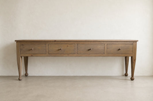 The Estate Console in Weathered Natural finish, front view of 96-inch four-drawer solid wood console