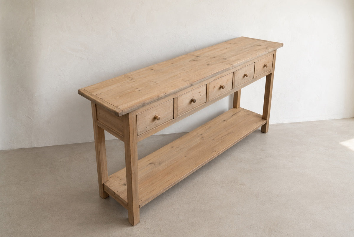 Elevated three-quarter view of the Mercantile five-drawer console table showing the top and lower shelf