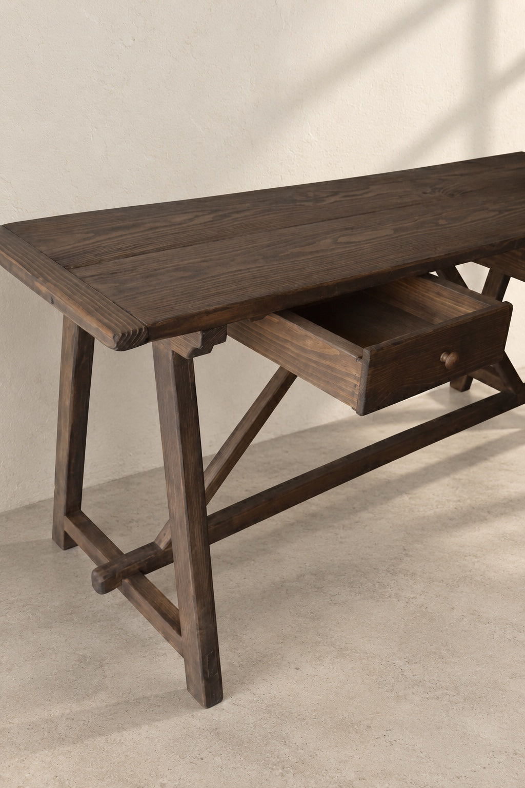 Open drawer and wood grain detail on The Trestle Console
